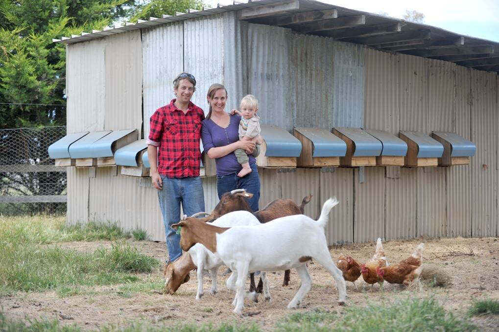Sarah Lockwood and Tadhgh Knaggs with 14 month-old Silas on their property in Kyneton.  