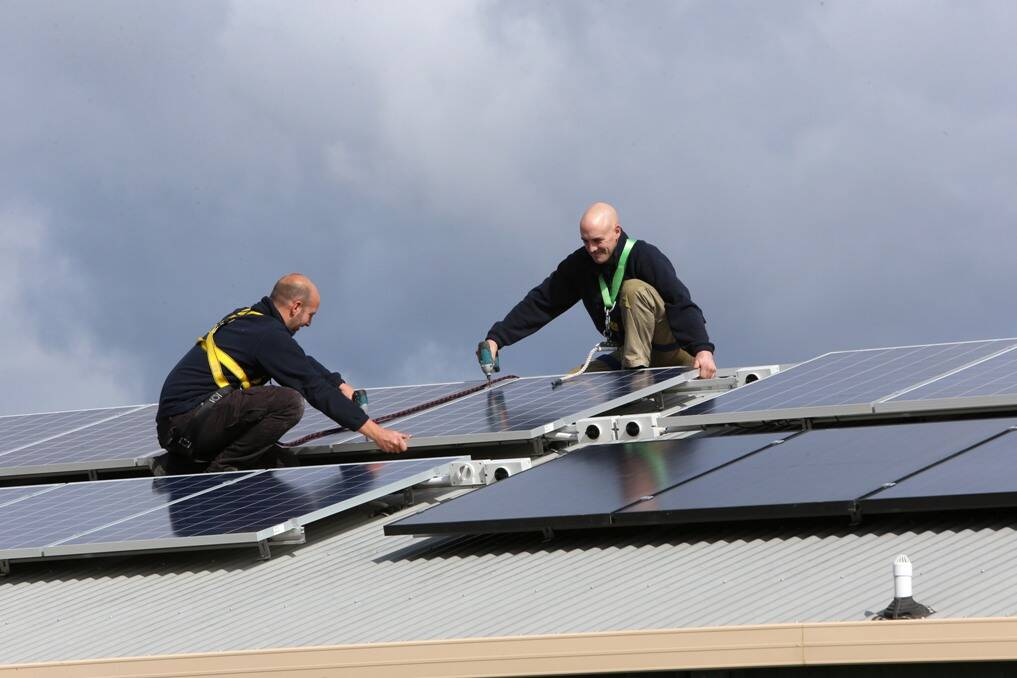 Solar installers Billy Lordan and Robert Jenkins work for Sunergy Solar in Bendigo. Picture: PETER WEAVING