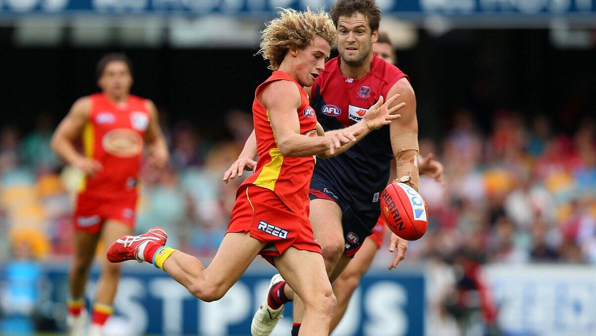 SKILFUL: Alik Magin in action for Gold Coast Suns against Melbourne in the 2011 AFL season. Picture: GETTY IMAGES