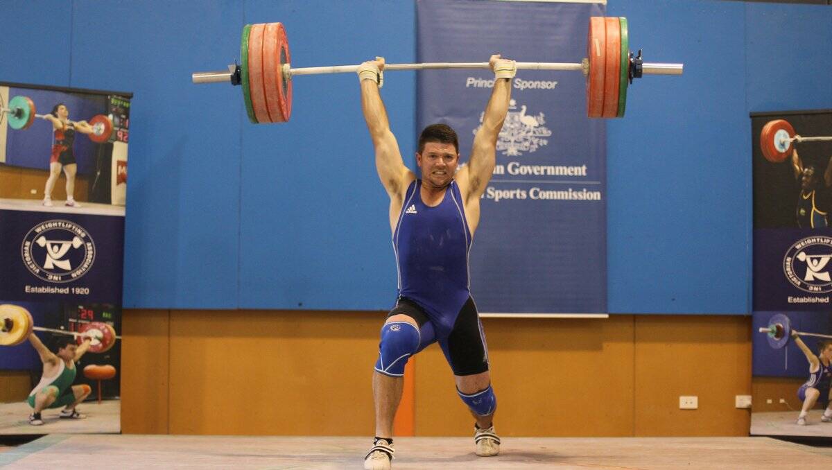 strength: Maiden Gully’s Troy Hewkins lifts for glory in the 85kg class at this year’s Victorian Weightlifting Championships.   Picture: GARY FEVREAU