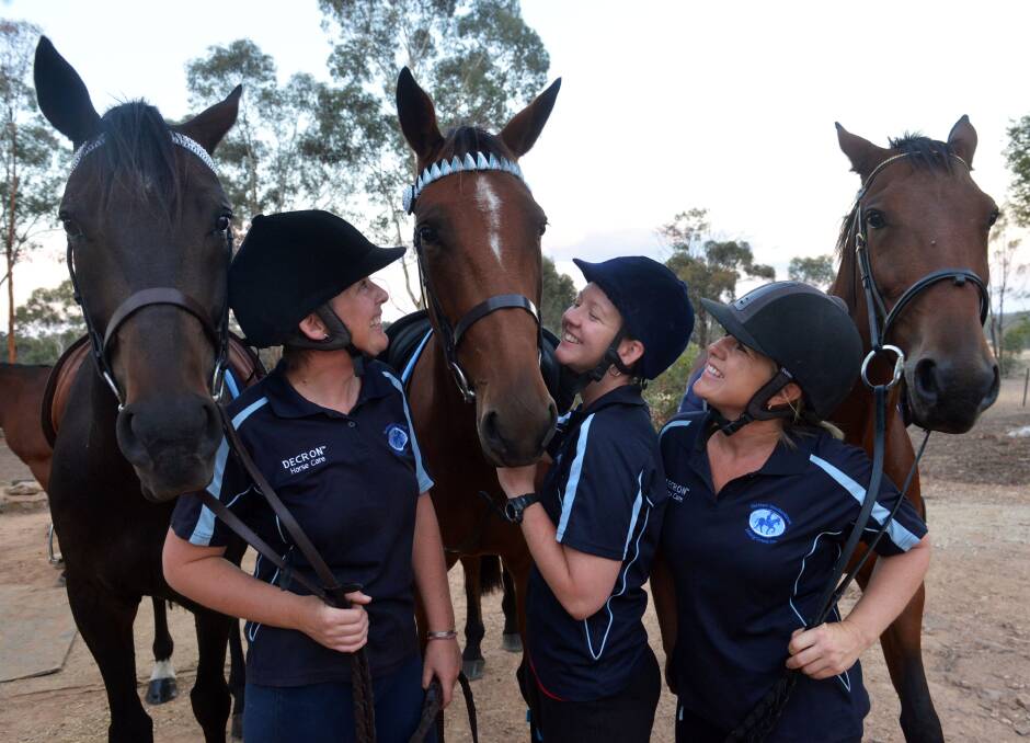 BRIGHT FUTURE: Northern Standardbred Riding Group president Tanya McDermott, treasurer Nikkiema Taylor and member Samantha Scanlon are giving Noddy, Moee, Ibis and many horses like them a chance to shine away from the harness track. Picture: BRENDAN McCARTHY