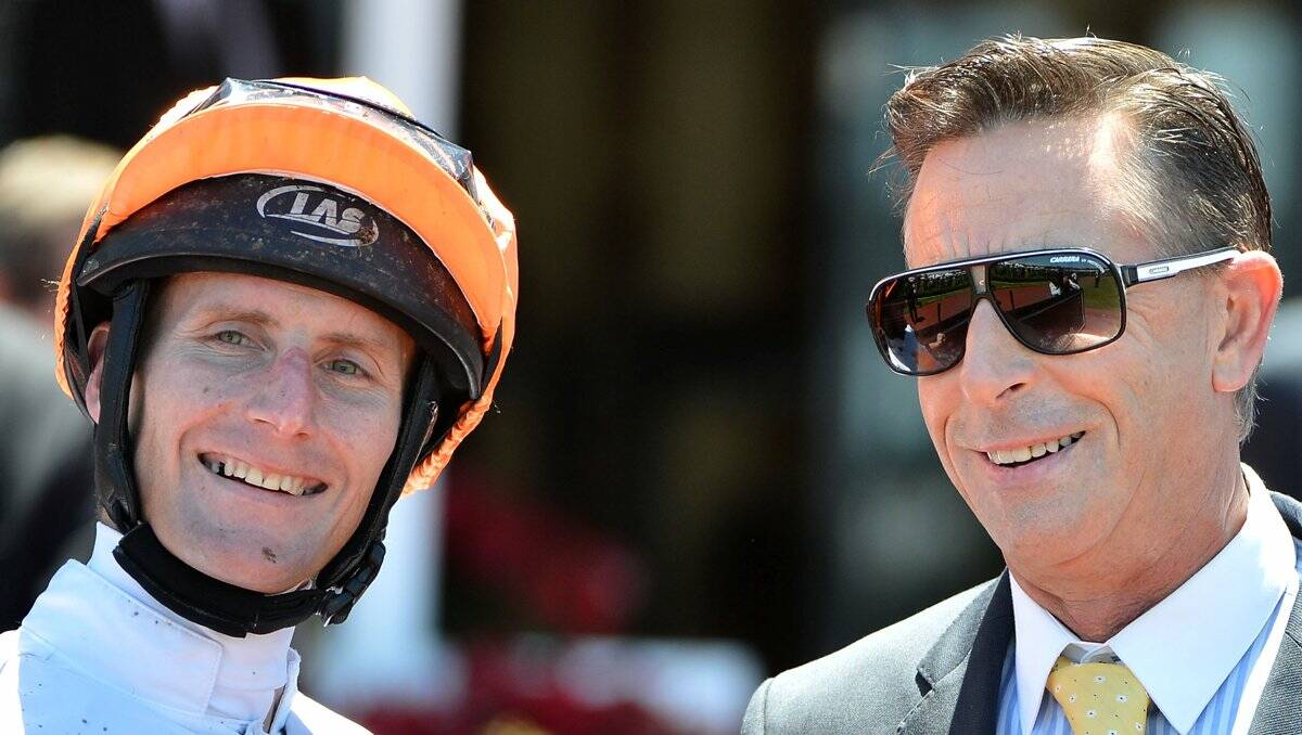 ALL SMILES: Brad Rawiller and trainer Michael Kent after winning last month's Dover Handicap at Flemington. Picture: GETTY 
