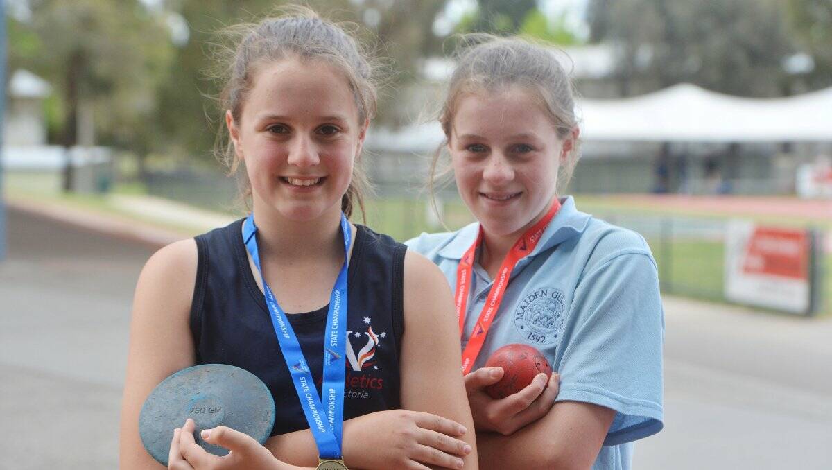 young champions: Bree Heiden and Danielle O’Toole, both 11, won medals in throwing events at the recent Victorian primary schools track and field championships in Melbourne. Bree was later named in the state representative team. Picture: BRENDAN McCARTHY 