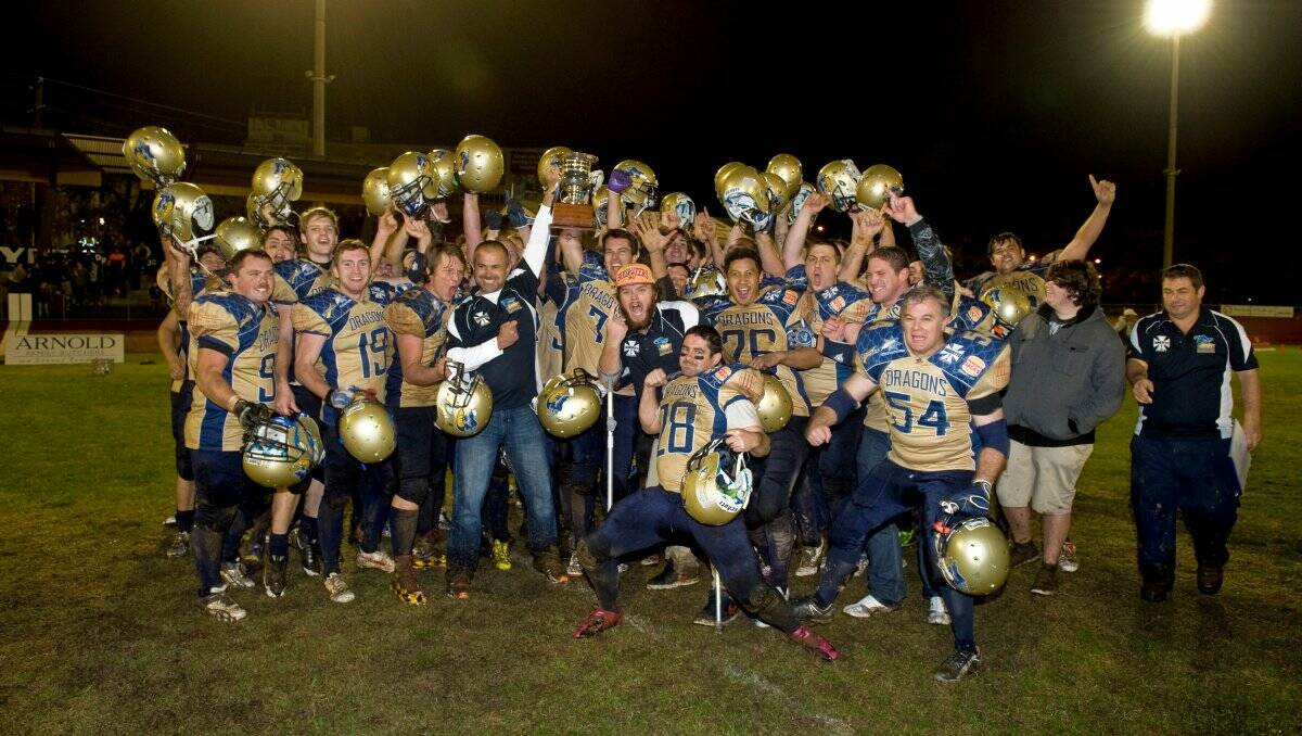 EXCITED: The Bendigo Dragons celebrate their first win in the Victorian Gridiron League on Saturday night at the Tom Flood Sports Centre. Picture: JIM ALDERSEY