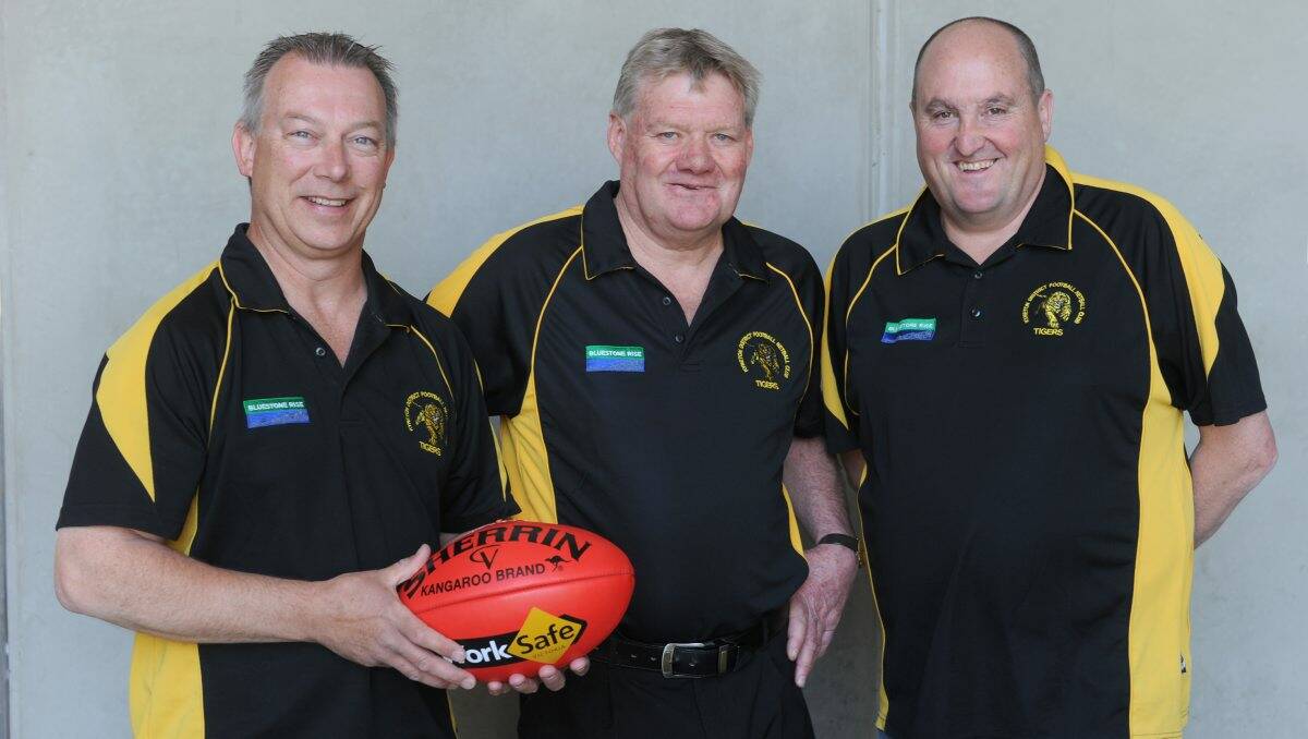 Kyneton Football Netball Club treasurer Chris Plowman, new coach Brian Walsh and president Anthony O’Connor. Picture: PETER WEAVING 