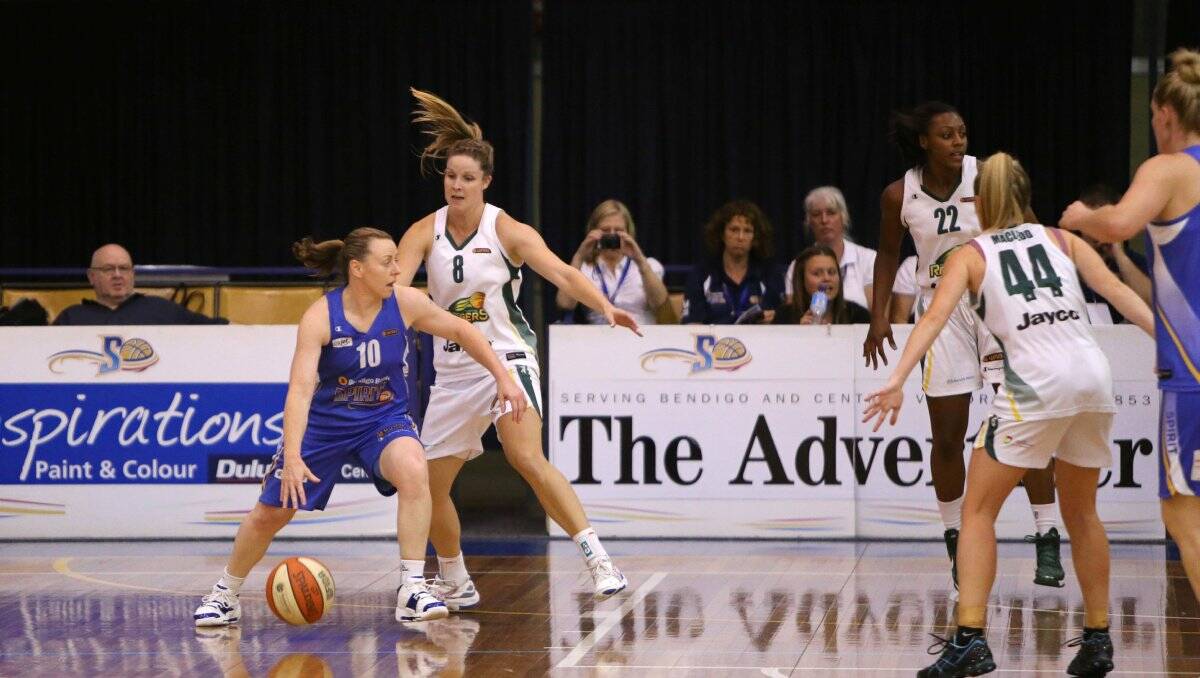 INSPIRATIONAL: Bendigo Spirit guard Kristi Harrower sets up another attack in Sunday's second semi-final win against Dandenong. Picture: PETER WEAVING 