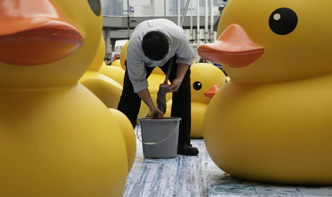Dutch conceptual artist, Florentijin Hofman's Floating duck sculpture called 'Spreading Joy Around the World' is given a warm welcome in Hong Kong. Photo: Getty Images