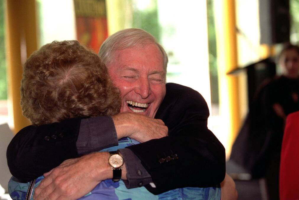 Bryce Courtenay embraces a friend at one of his book launches. Photo: Simon O'Dwyer