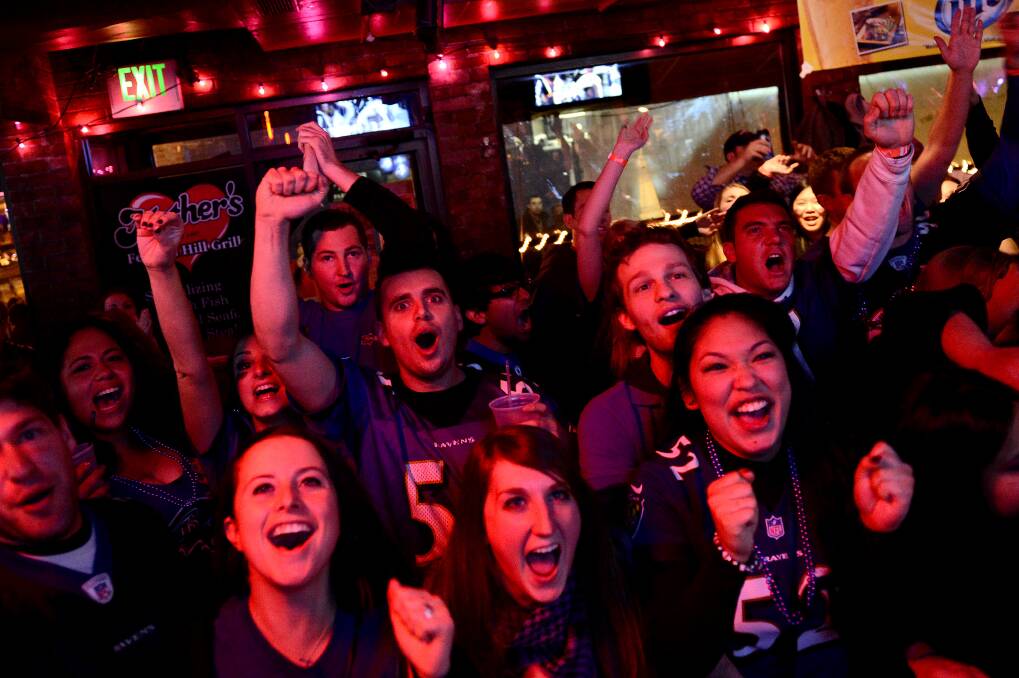 Fans of the Ravens celebrate after the team's victory over the 49ers. Photo: Photo by Patrick Smith/Getty Images