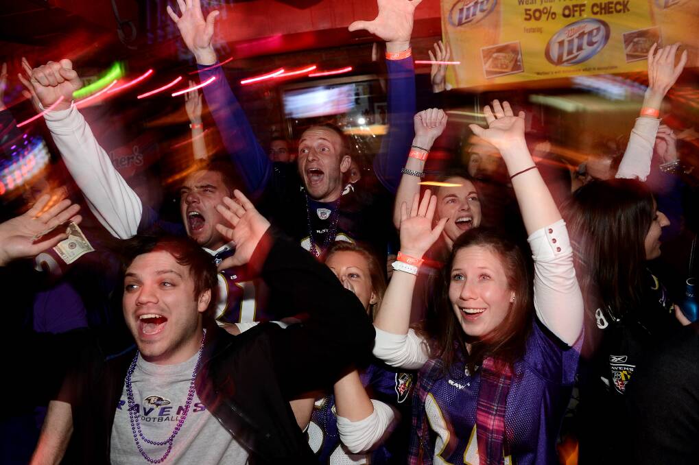 Fans of the Ravens celebrate after the team's victory over the 49ers. Photo: Photo by Patrick Smith/Getty Images