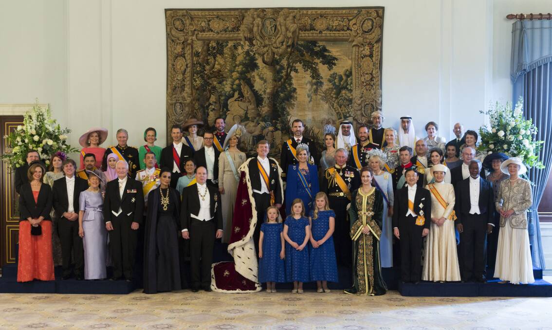 King Willem Alexander and Queen Maxima of the Netherlands pose with guests following their inauguration ceremony. Photo: Getty Images