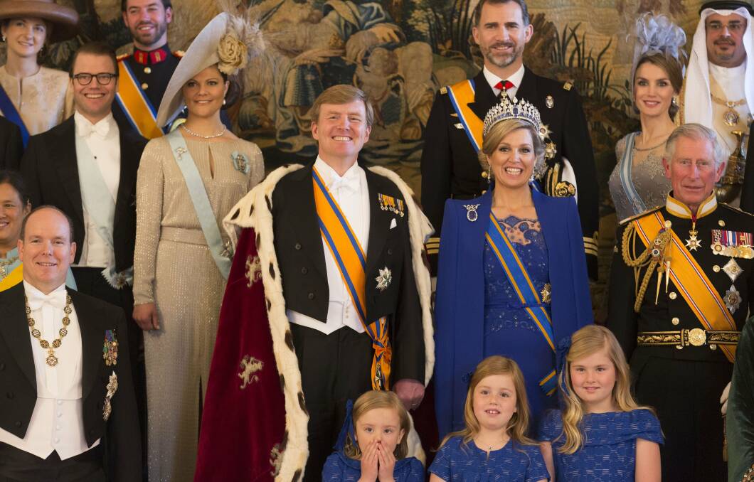 King Willem Alexander and Queen Maxima of the Netherlands pose with guests following their inauguration ceremony. Photo: Getty Images
