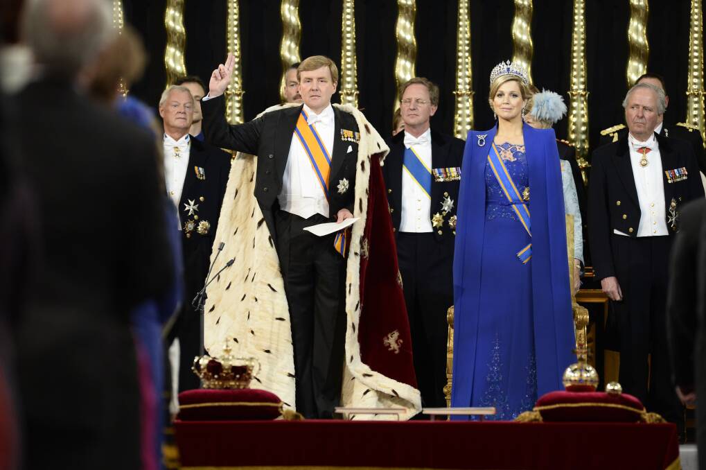 HM King Willem-Alexander of the Netherlands takes an oath as he stands alongside HM Queen Maxima of the Netherlands during his swearing in. Photo by Lex Van Lieshout - Pool/Getty Images