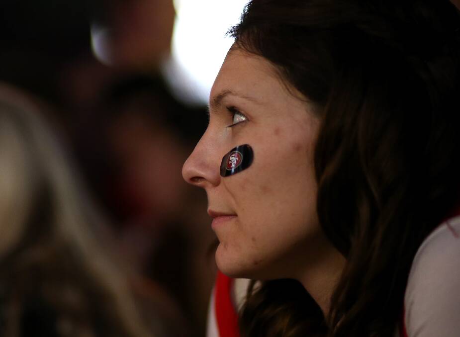 Fans of the San Francisco 49ers glumly look on as their team loses to the Baltimore Ravens. Photo: Justin Sullivan