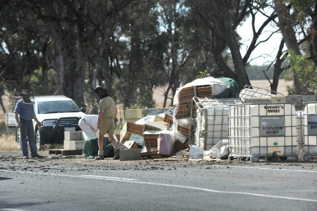 Angry bees are at the scene of a truck roll over on the Bendigo-Maryborough Road.