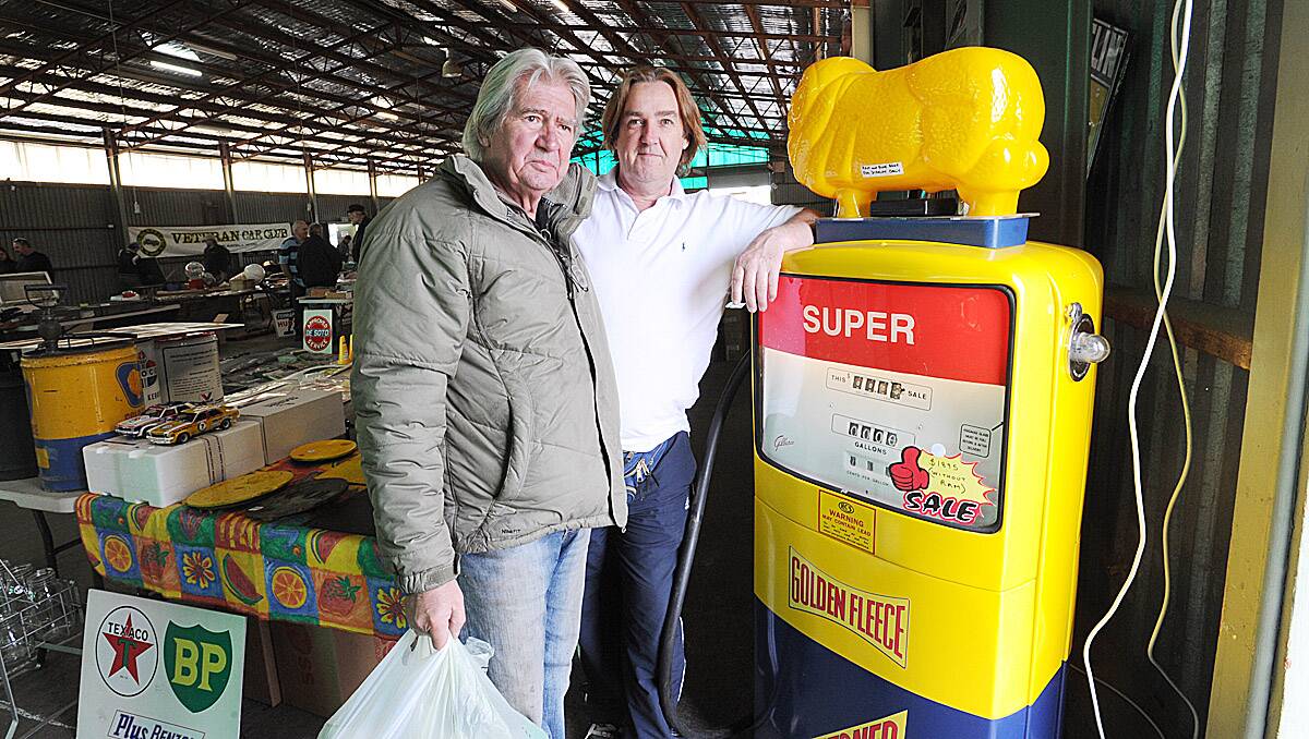 Peter Landers (Castlemaine) and Geoff Stubbs (sydney) with a 1950s Sales Maker petrol pump