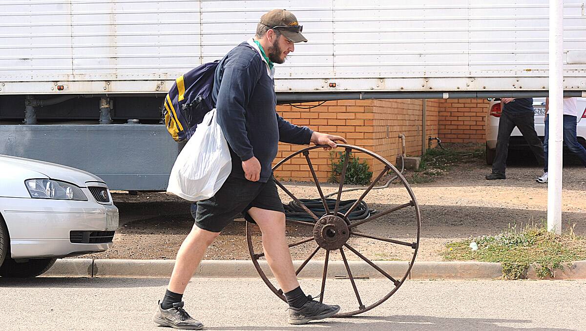 Josh Fowles, of Mildura rolls out a Furphy wheel.