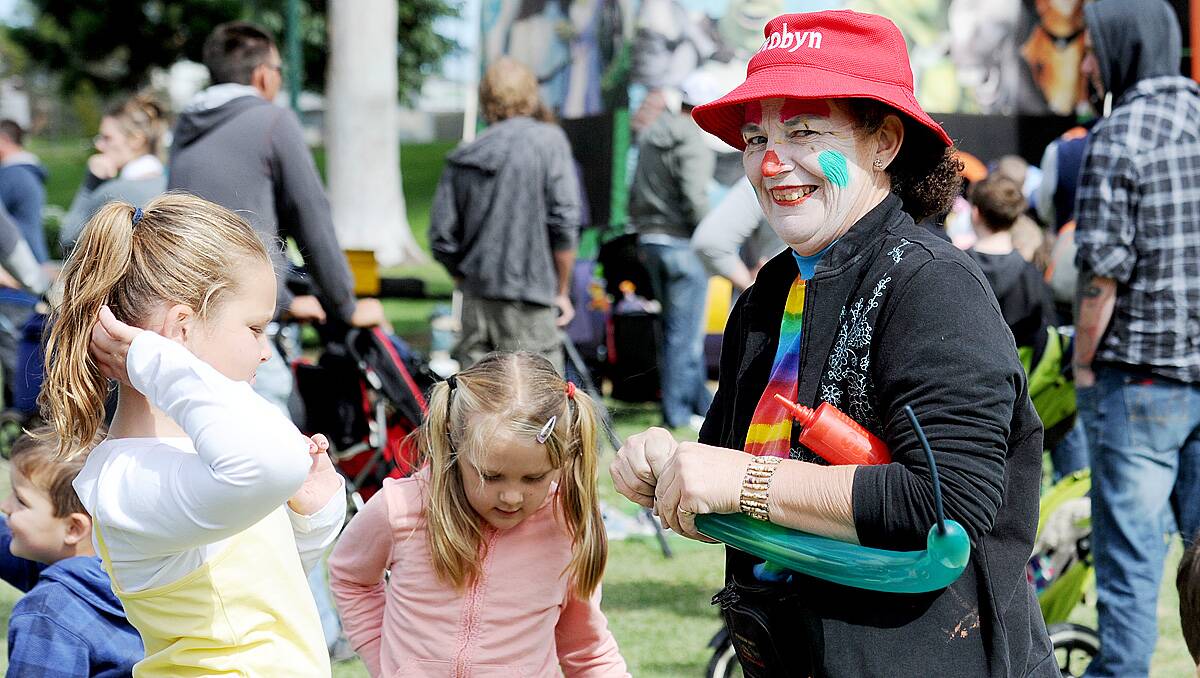 Robyn the clown makes balloons animals at the Dahlia and Arts Festival family fun day. Picture: Jodie Donnellan 