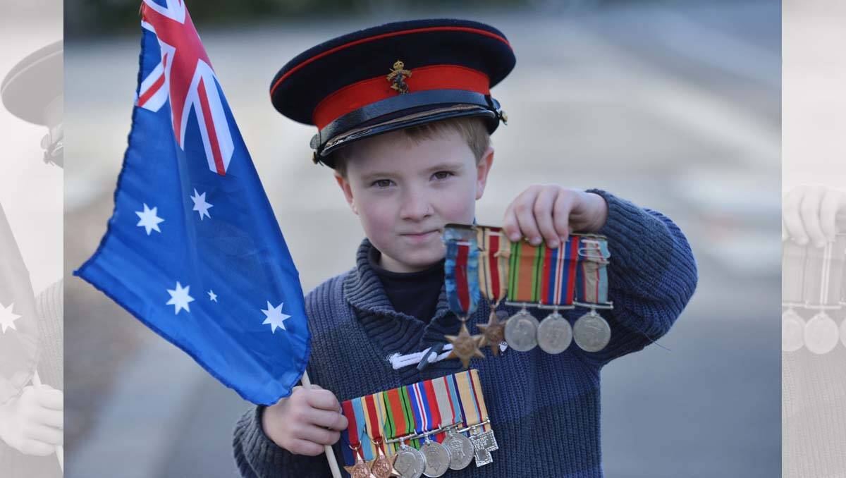Eaglehawk Anzac Day service. William Hemmes-Windsor with the medals and hat of his grandfather Lt Col M. R. Windsor who was one of the Rats of Tobruk. Picture: Brendan McCarthy