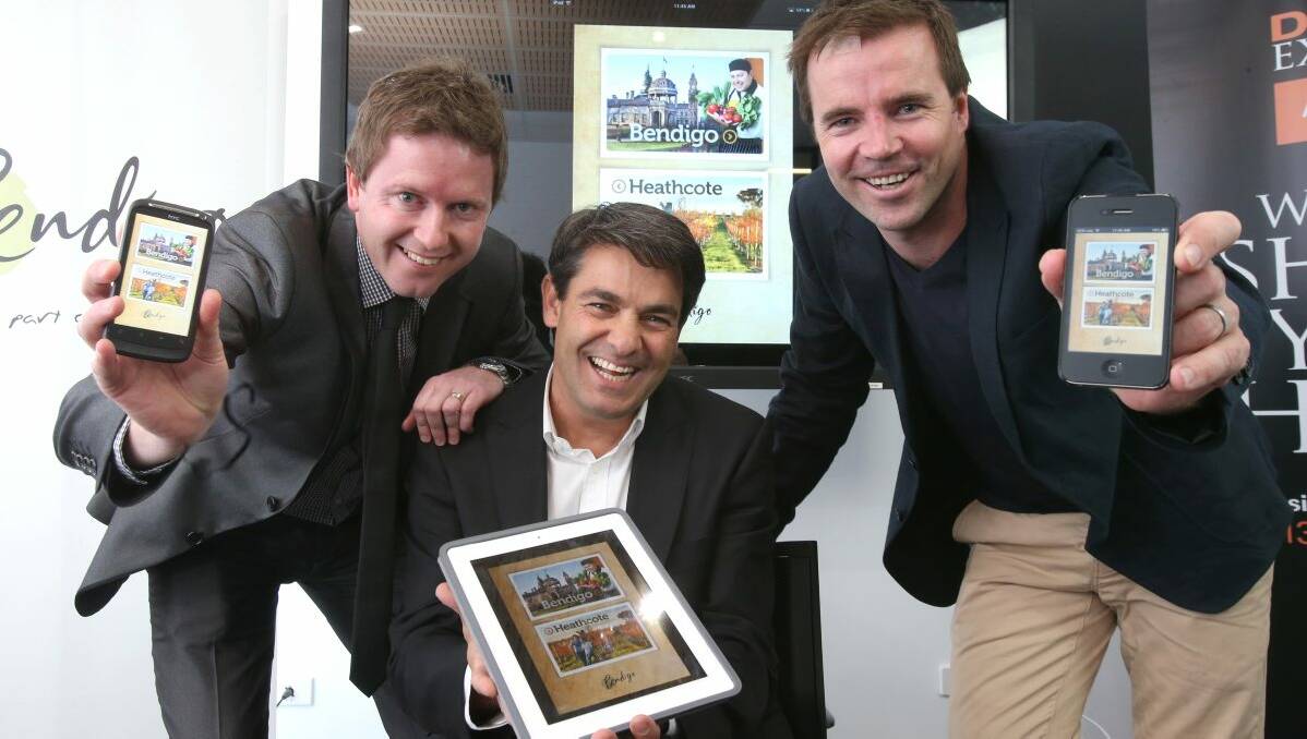 City of Greater Bendigo’s Glenn Harvey and Stan Liacos with Tim Gentle showing off the new app. 
