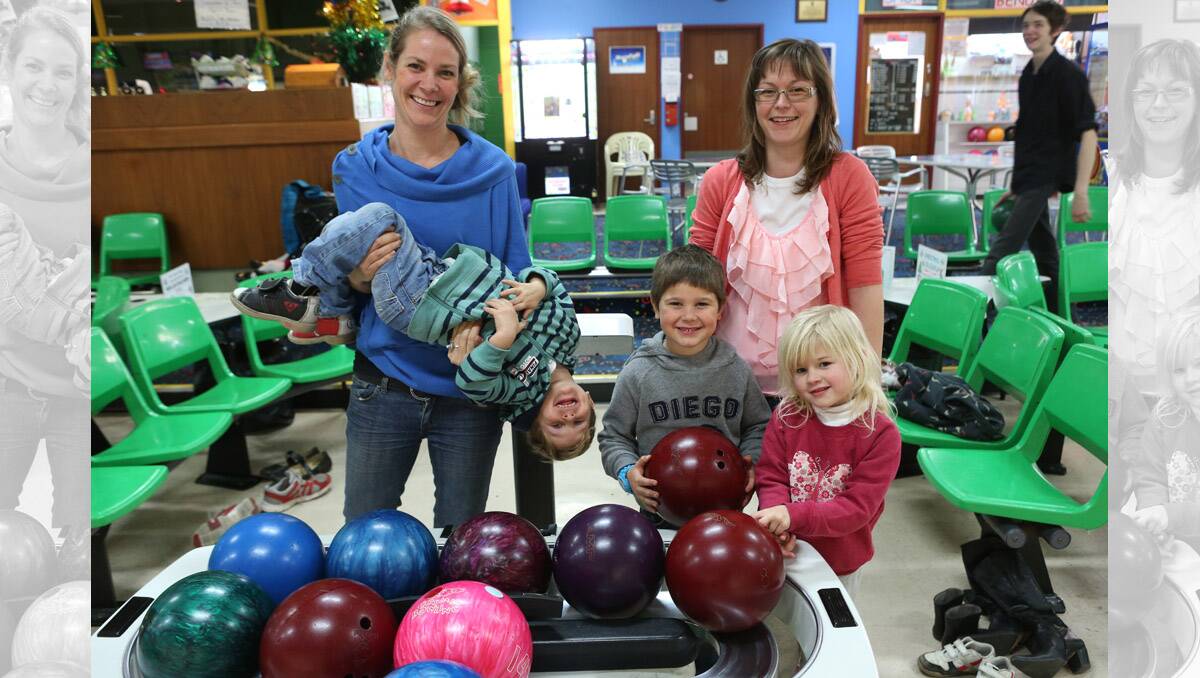 Dragon City Lanes, lanes are full during the school holidays. Rebecca Bottros with Shobi 3 and Noah 5 with Fiona Cullen and Navaeh 4. Pictures: Peter Weaving 