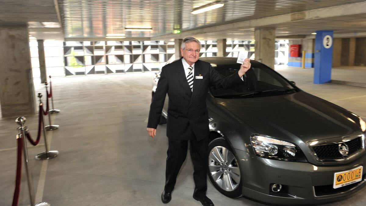 Plenty of Space: City of Greater Bendigo mayor Alec Sandner arrives just in time to officially open the multistorey Edward Street car park yesterday, as he waves his – and the first – parking ticket.