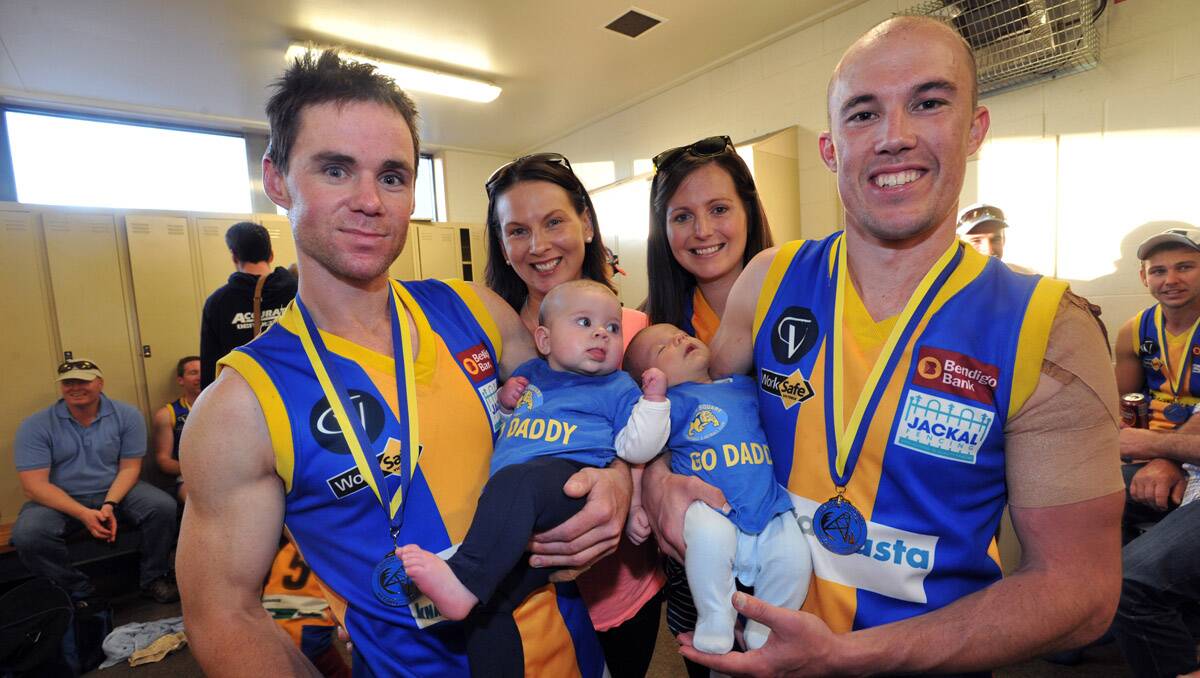 BFNL grand final. Christian Carter with his 6-month-old daughter Poppy and Mark Lloyd with his 1-month-old son Alfie. Picture: Julie Hough