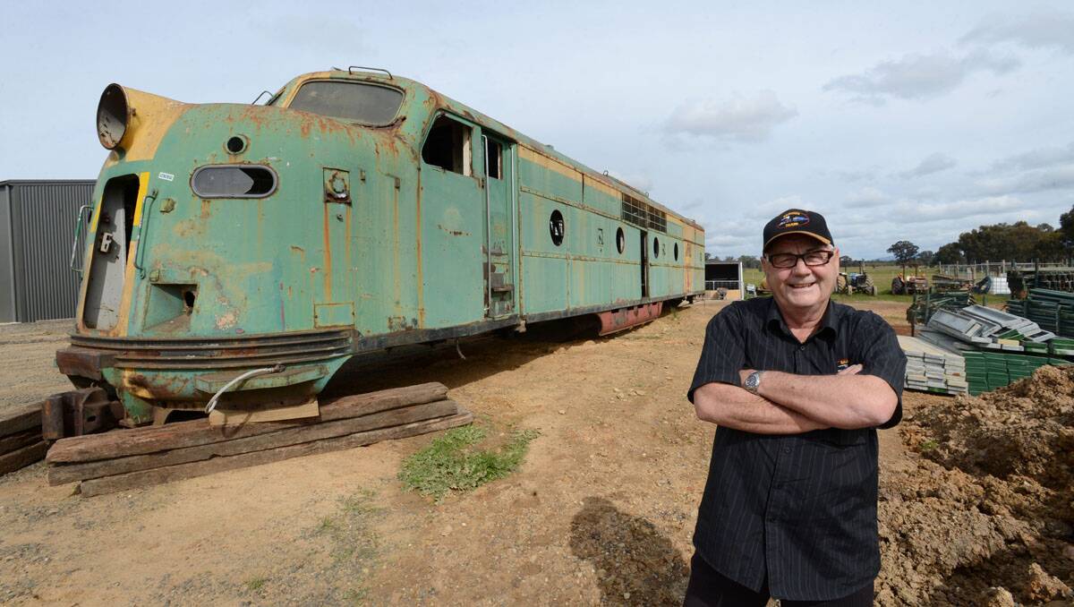 Bob Braidie and the GM 25 locomotive he plans to turn into a bar for the beer garden at Braidie's Tavern.  Picture: Jim Aldersey