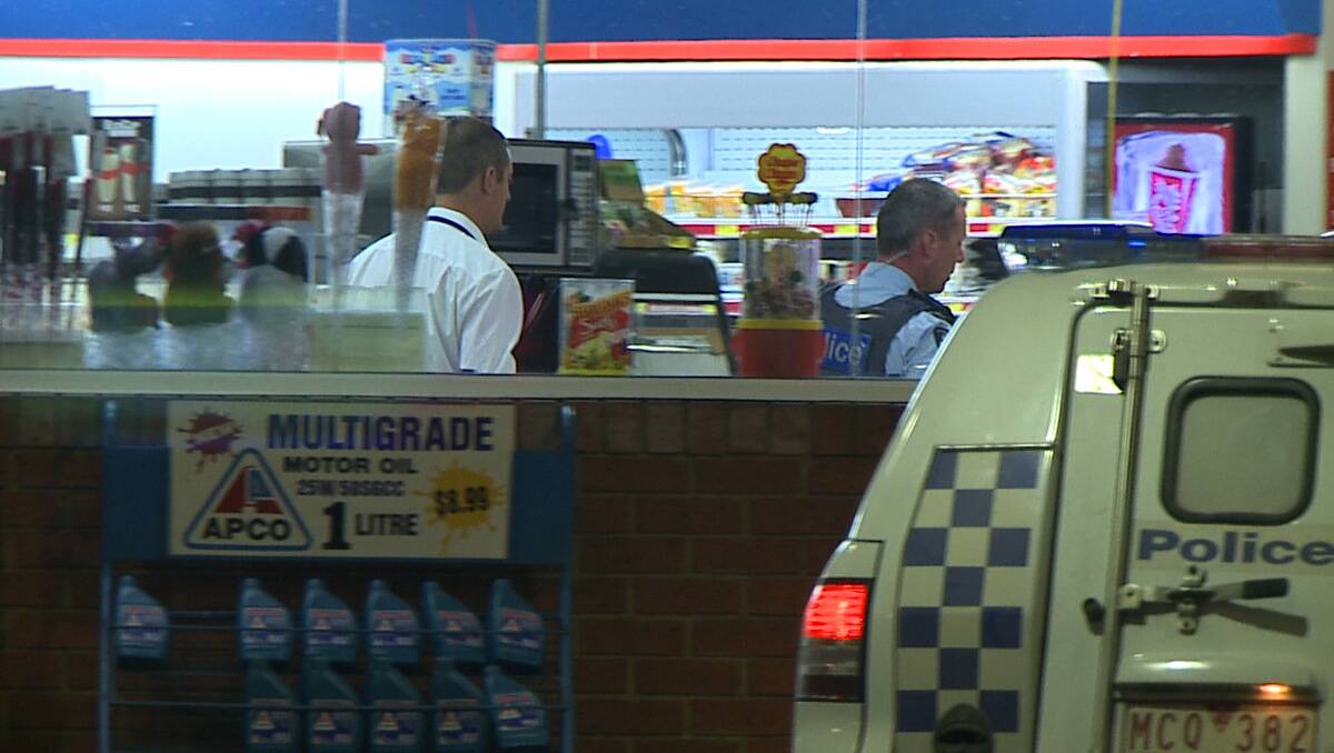 Police at the Apco service station last night. Picture: Apex Imagery