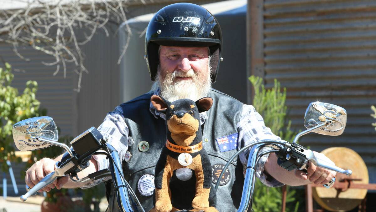 Talk about it: Ric Raftis and his dog Winston will ride to raise awareness of depression and suicide prevention, and to raise money for Lifeline. 