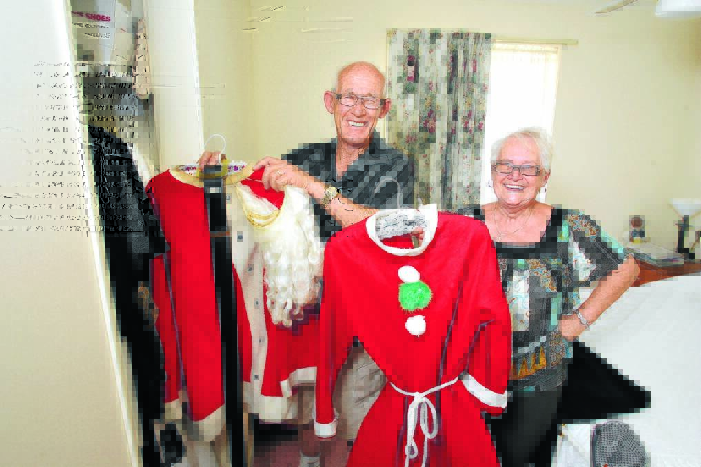 MR AND MRS CLAUS: Bendigo couple Geoff and Lorna Peirce are hanging up their Santa suits. Picture: PETER WEAVING