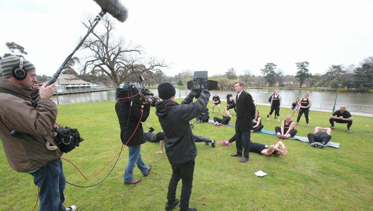 The Today Show team broadcasting weather updates from Lake Weeroona with weather man Mike Dalton. Bendigo's 3T Fitness crew is in the background. Picture: Peter Weaving