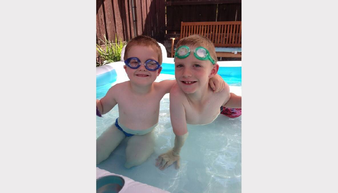 Brothers Morrison and Bradman cool down in their paddling pool. Picture: Beck