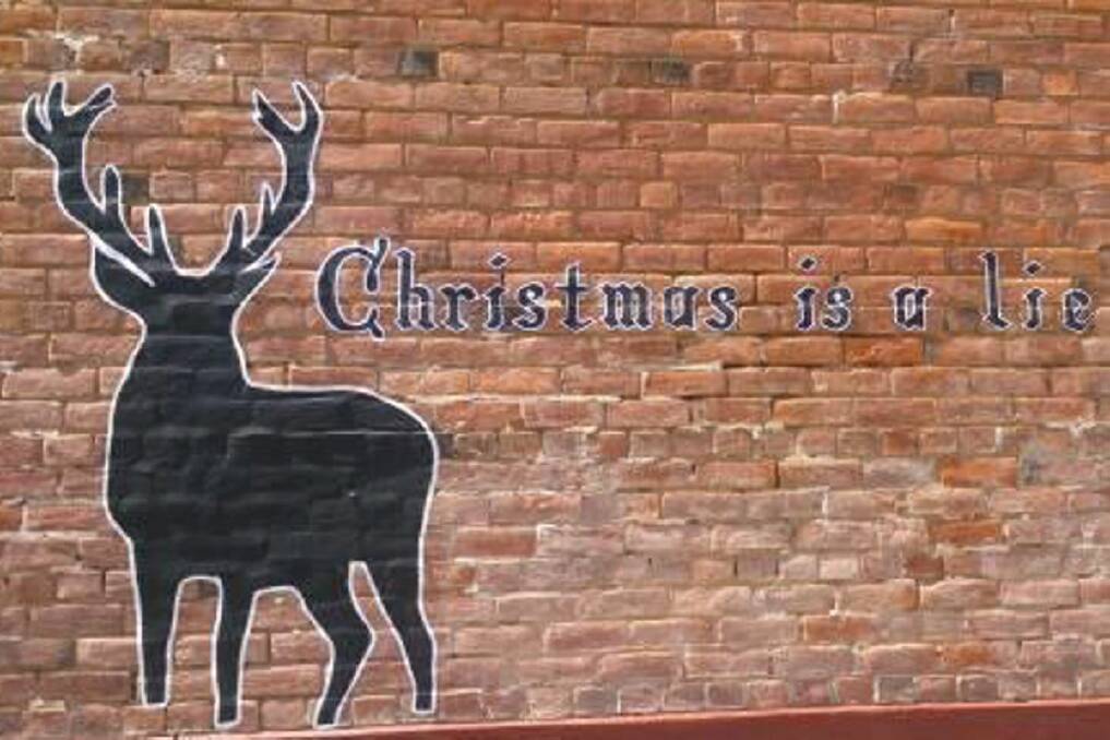BEFORE: The original paste-up read "Christmas is a lie". Picture: SUPPLIED
