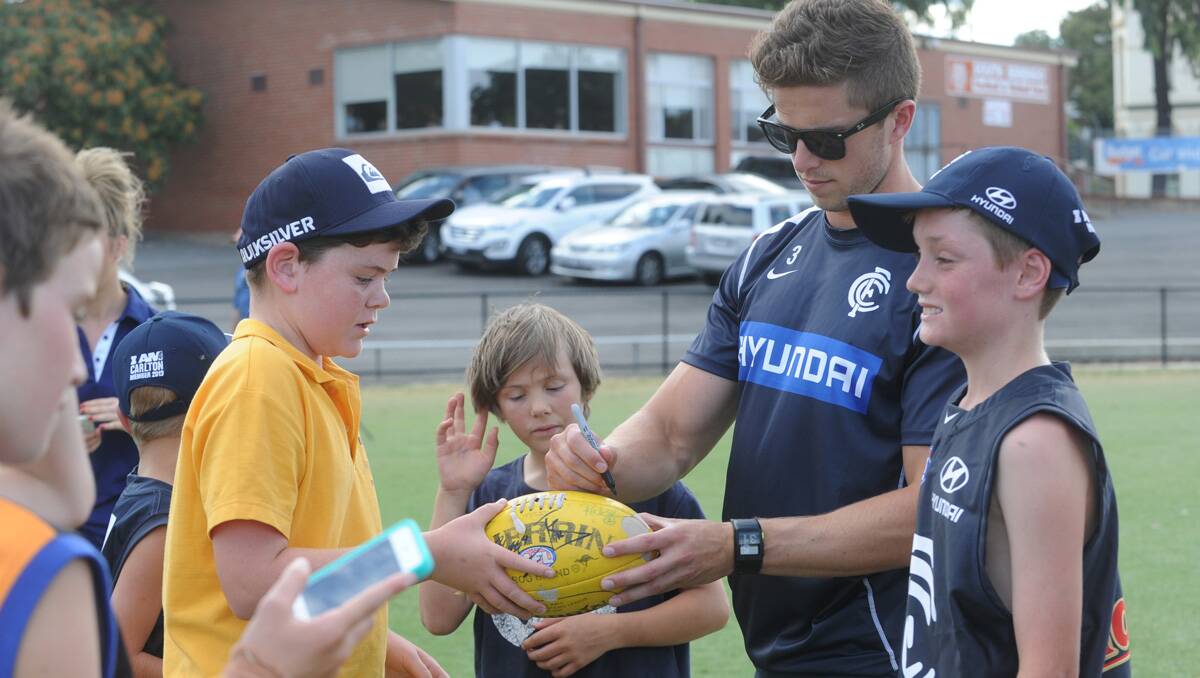Carlton super clinic at the QEO. Marc Murphy with fan Lachie Horan. Picture: Jodie Donnellan