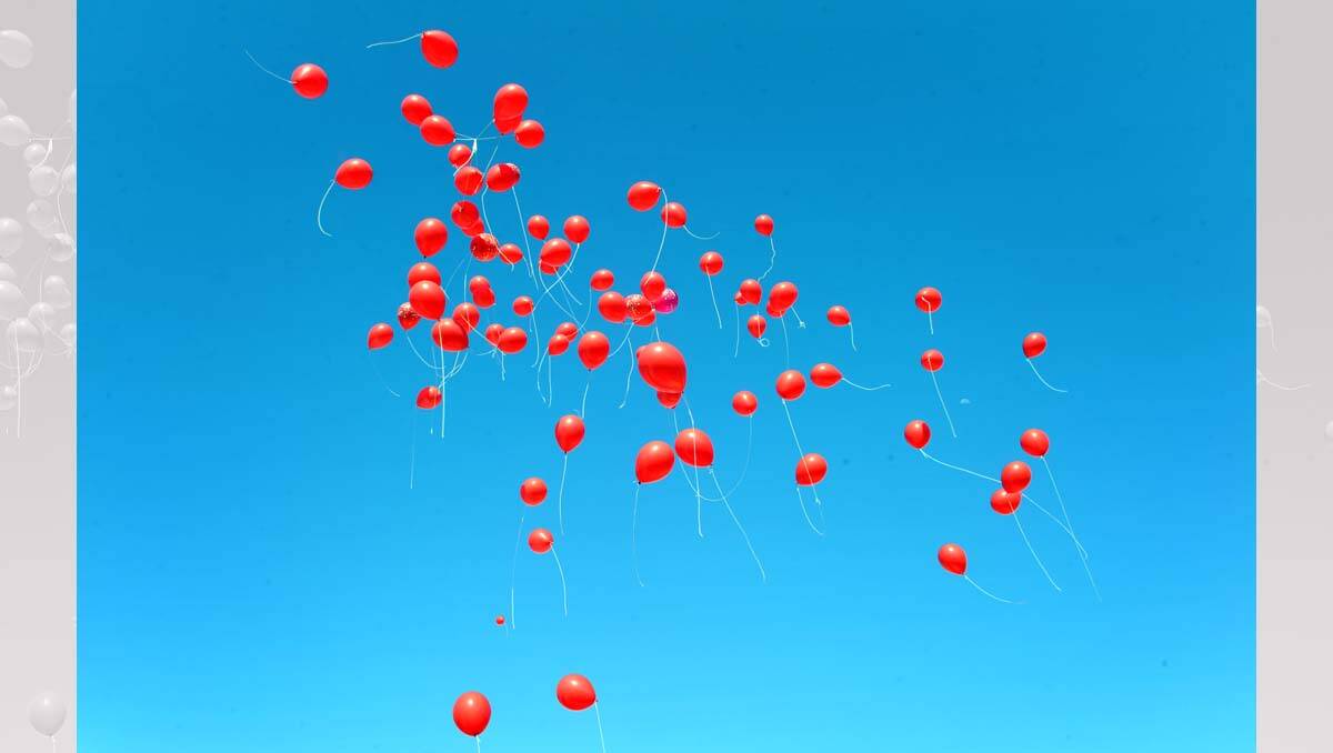 Balloons are released at the launch of author Katrina Nannestad's book Red Dirty Diary. Picture: Jim Aldersey