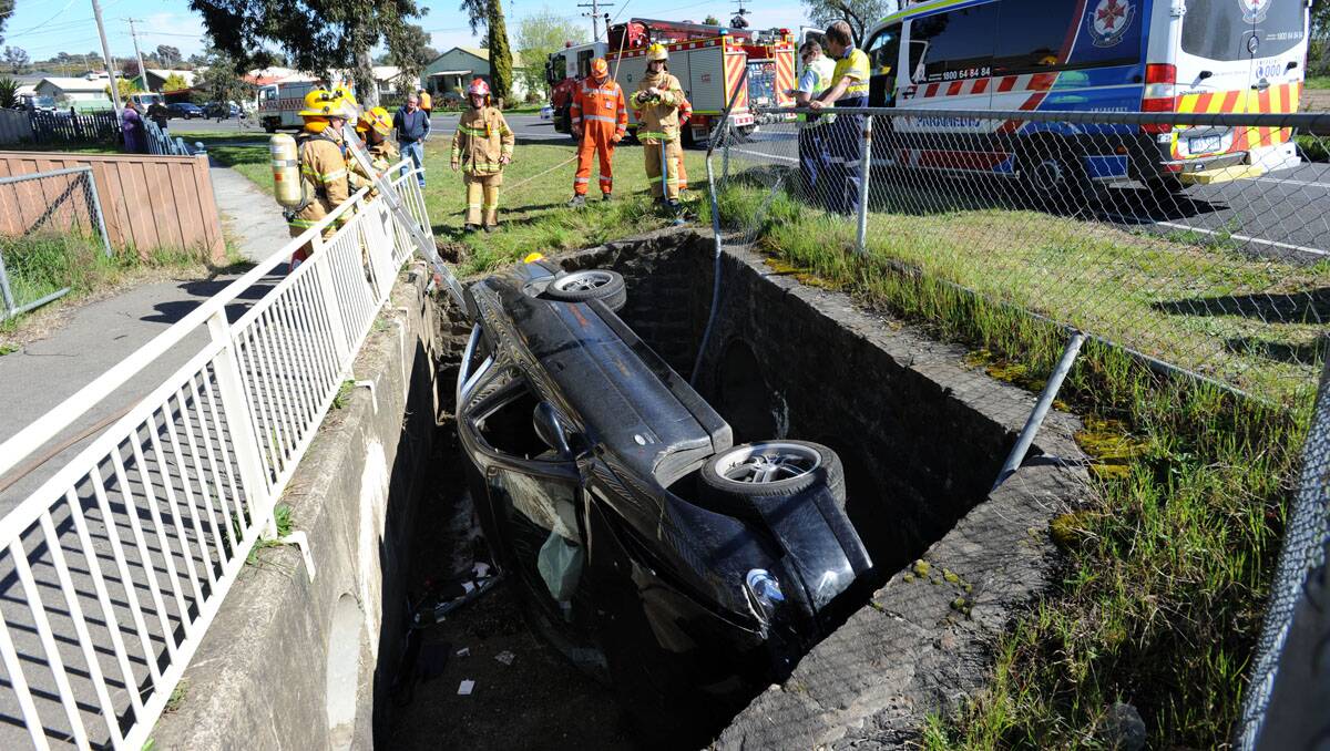 The car in the drain at Long Gully. Picture: Peter Weaving