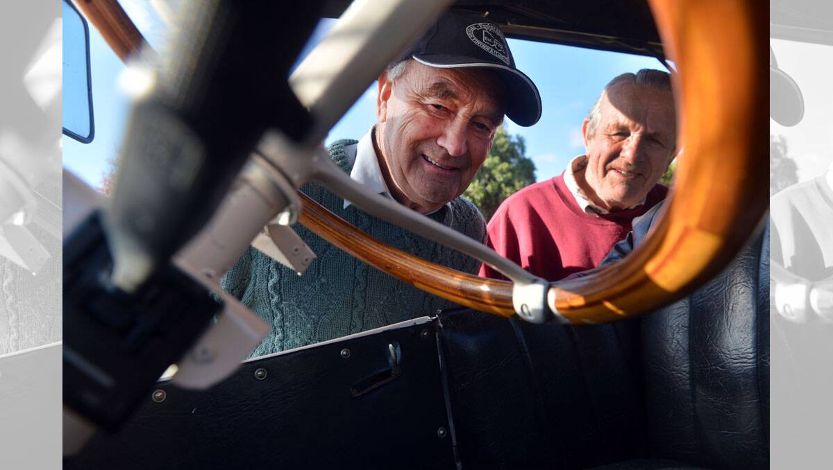 National Motoring Heritage Day at Castlemaine. Peter Brown from Bularto and John Ravell from Castlemaine looking over a 1921 Dodge. Picture: BRENDAN MCCARTHY.