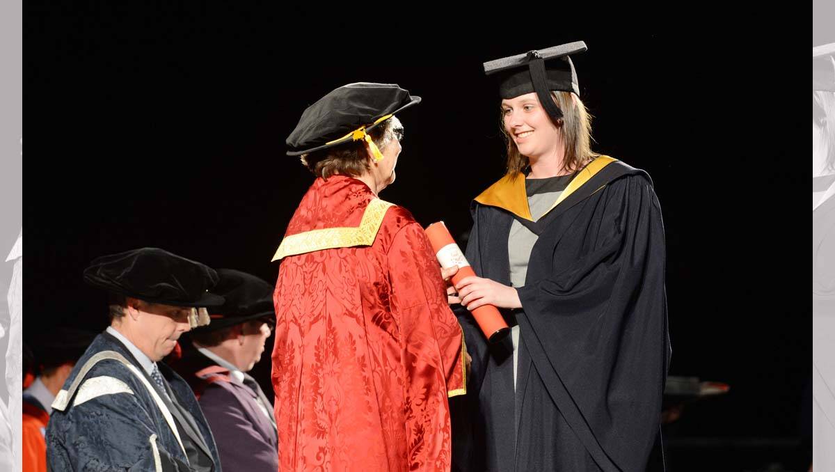 La Trobe University Bendigo graduation. Elise Foley receives her Bachelor of Pharmacy with Honours from Chancellor Adrienne Clarke . Picture: Jim Aldersey