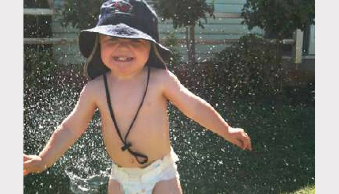 Henry Isaacs (20-months) having fun under the sprinkler at the family farm in Kurting. Picture: Bree Isaacs