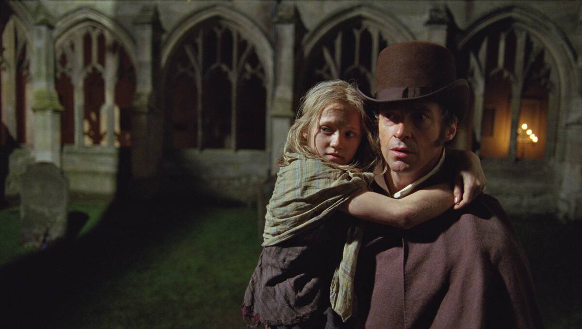 Isabelle Allen and Hugh Jackman in a scene from Les Misérables.