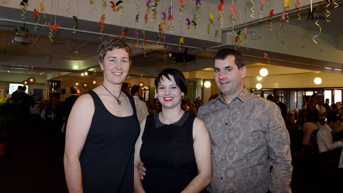 Penny Limmer with Shae, an employee of the year finalist, and Trevor Smith. Picture: Jim Aldersey