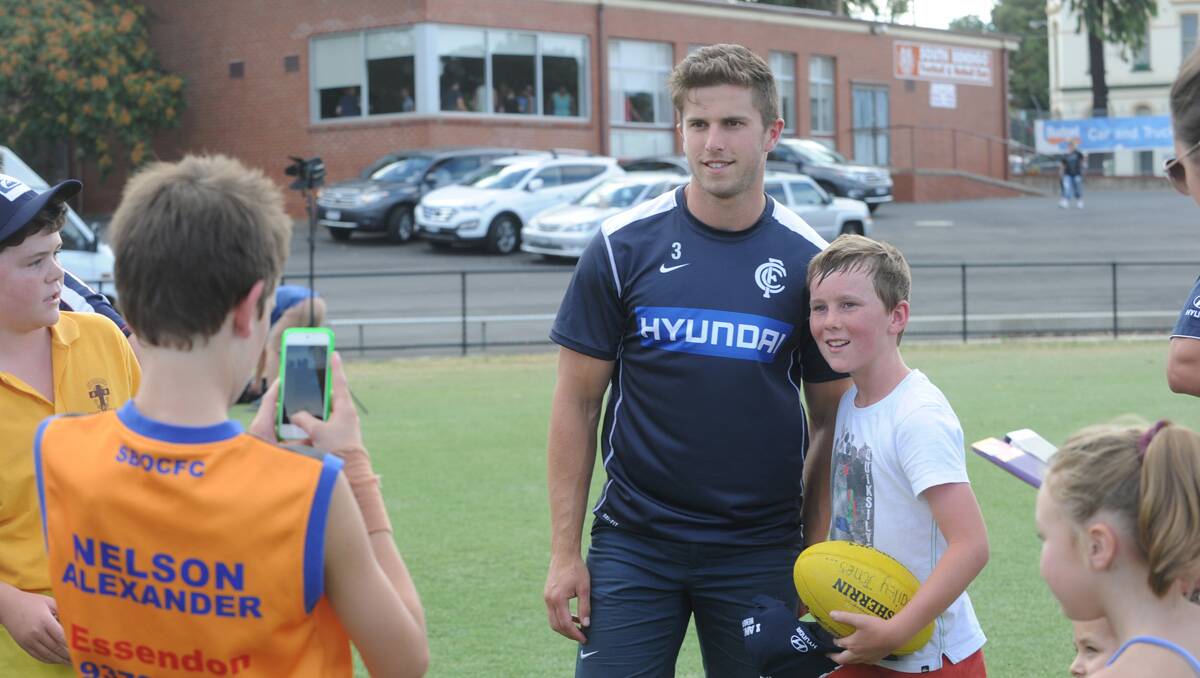Carlton super clinic at the QEO. Marc Murphy with fan Bailey Jones. Picture: Jodie Donnellan