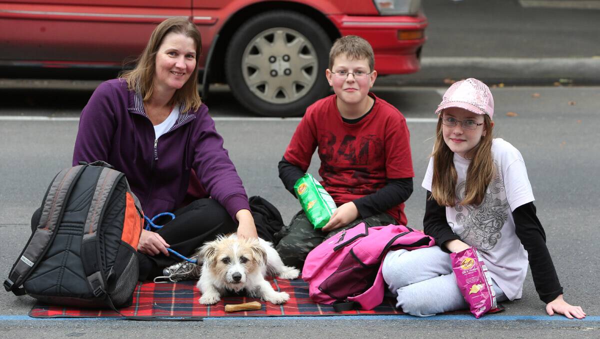 Fire Services Commissioner/CFA Torchlight Procession. Tanya Fraser with kids Aaron 13 and Emily 11 and Boof the dog. Picture: Peter Weaving