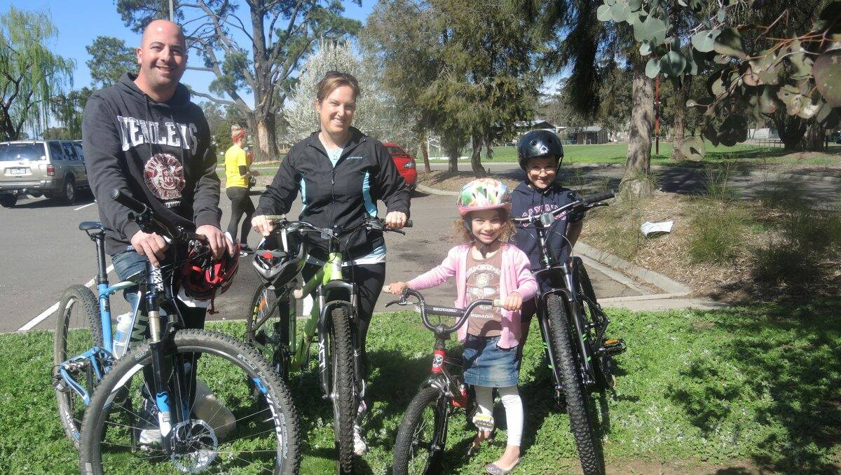 The Boyd family, from left, James, Joanne, Alysha, 5, and Campbell, 8, rode their bikes to vote at Strathfieldsaye Recreation Reserve Sports Club. Picture: Hannah Knight