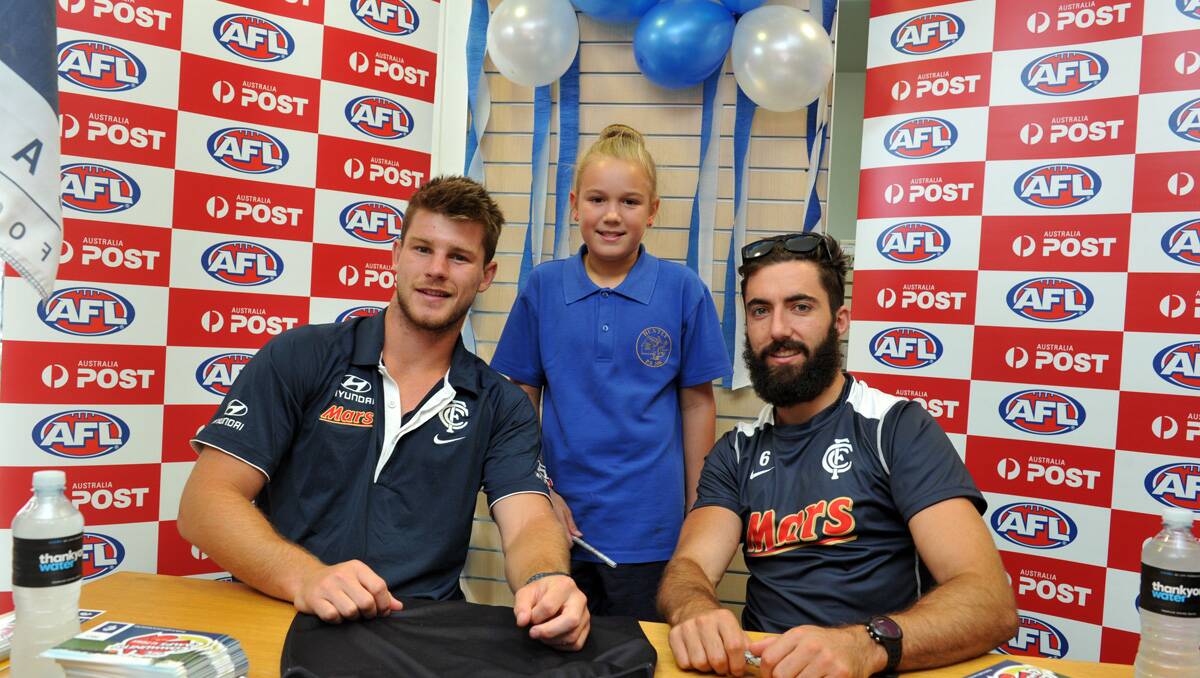 Bryce Gibbs and Kade Simpson meet some fans. Picture: Jim Aldersey