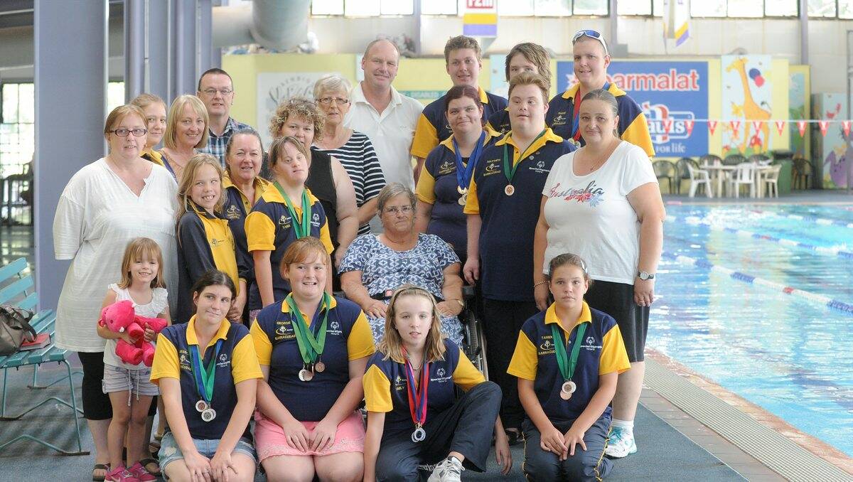 GROUP EFFORT: The Bendigo Barracudas swimming team with family members. Picture: JODIE DONNELLAN