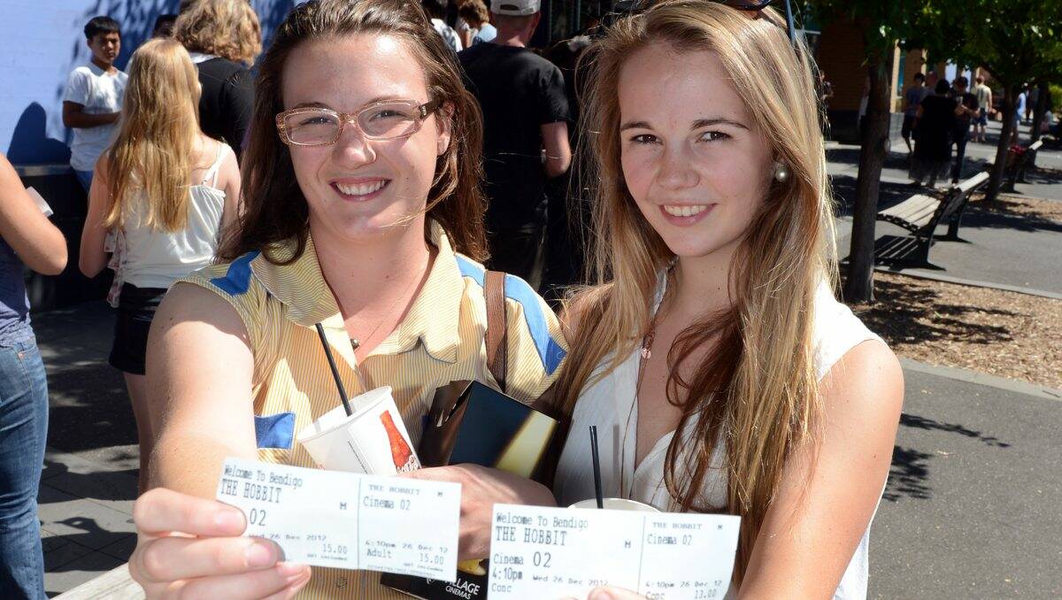PATIENT: Ellen and Lucy Cumming with their tickets to the Hobbit. Picture: JIM ALDERSEY