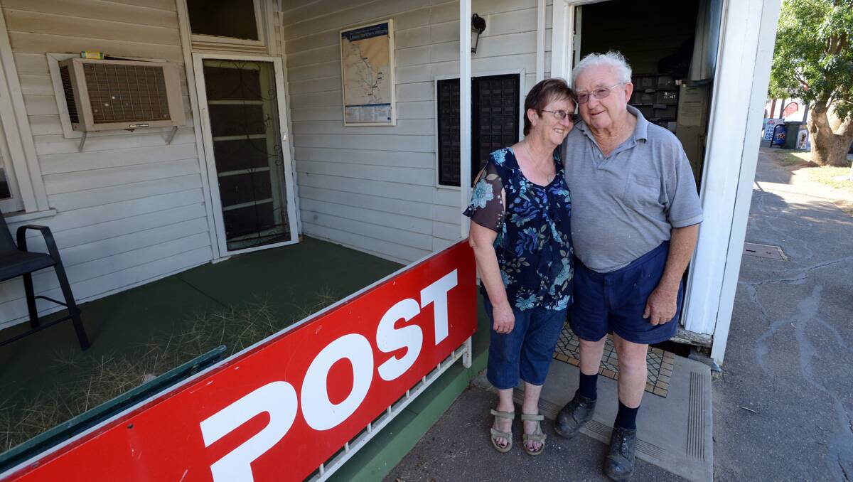 HAPPY: Lois and Barry outside the Mitamo post office they have run for 35 years. Picture: Jim Aldersey
