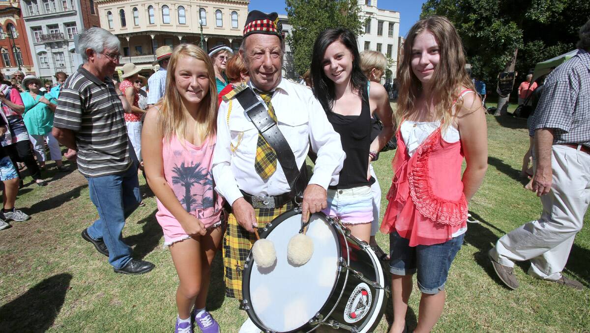 Bendigo's first Scots Day Out event. Drummer Tony Pianta with his grandkids Tahlee Naylor-Pianta and Rani and Tamika Crutchfield. Picture: Peter Weaving